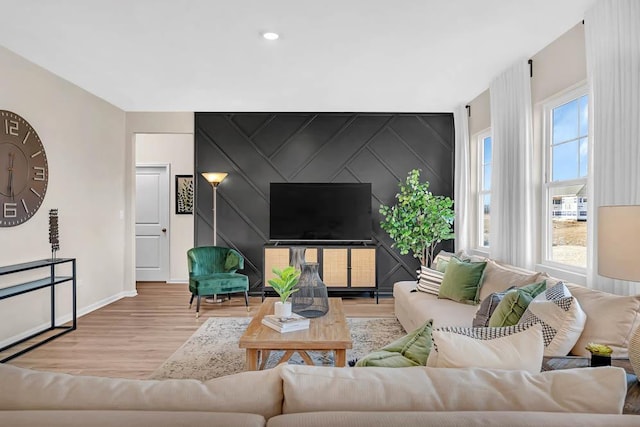 311 Snowdrop Ln, Elgin, IL 60124 - living room featuring wood finished floors, an accent wall, and recessed lighting