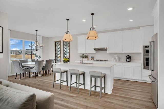 311 Snowdrop Ln, Elgin, IL 60124 - kitchen featuring gas stovetop, high end fridge, light wood-type flooring, light countertops, and white cabinets