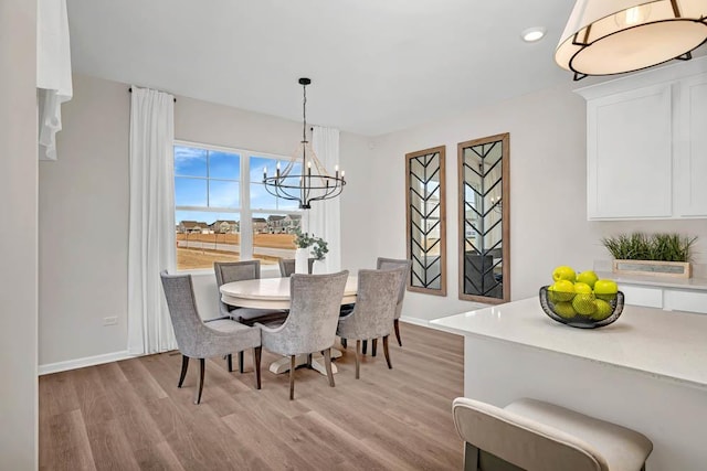 311 Snowdrop Ln, Elgin, IL 60124 - dining room with light wood-style flooring, a chandelier, and recessed lighting