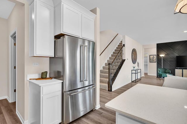 311 Snowdrop Ln, Elgin, IL 60124 - kitchen with high end fridge, wood finished floors, white cabinetry, and open floor plan