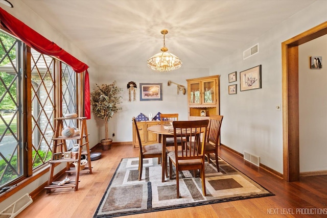 4S064 Hazelcrest Dr, Sugar Grove, IL 60554 - dining area featuring a chandelier and wood finished floors