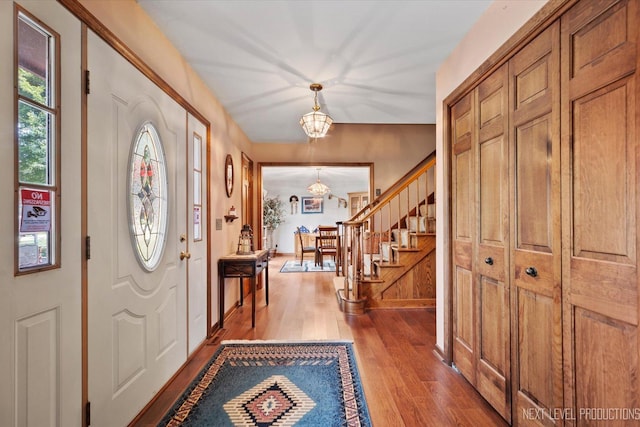 4S064 Hazelcrest Dr, Sugar Grove, IL 60554 - entryway featuring a chandelier, wood finished floors, and stairs