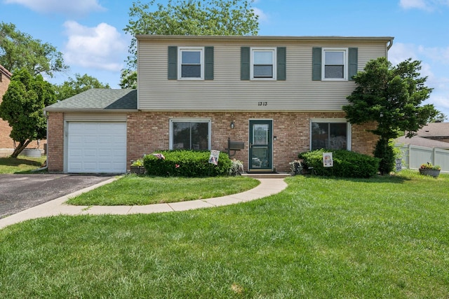 1313 Glen Hill Dr, Glendale Heights, IL 60139 - view of front facade with an attached garage, a front yard, brick siding, and asphalt driveway