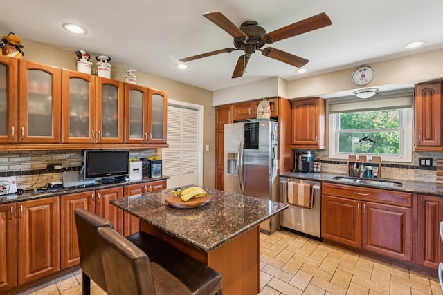 1313 Glen Hill Dr, Glendale Heights, IL 60139 - kitchen with appliances with stainless steel finishes, decorative backsplash, ceiling fan, dark stone countertops, and recessed lighting