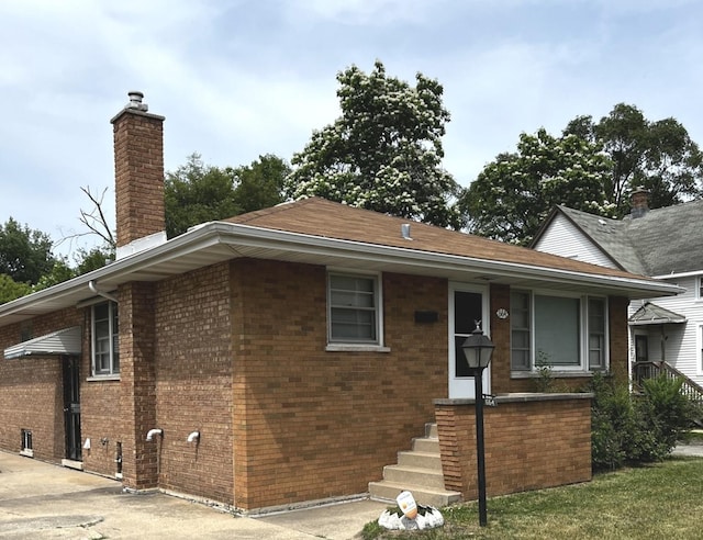 664 E 142nd St, Dolton, IL 60419 - view of front of property with brick siding and a chimney