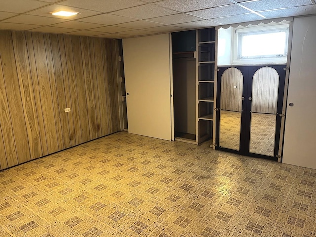 664 E 142nd St, Dolton, IL 60419 - basement featuring wooden walls and a drop ceiling