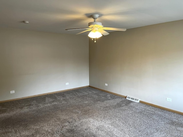 664 E 142nd St, Dolton, IL 60419 - unfurnished room featuring a ceiling fan, dark colored carpet, and a smoke detector