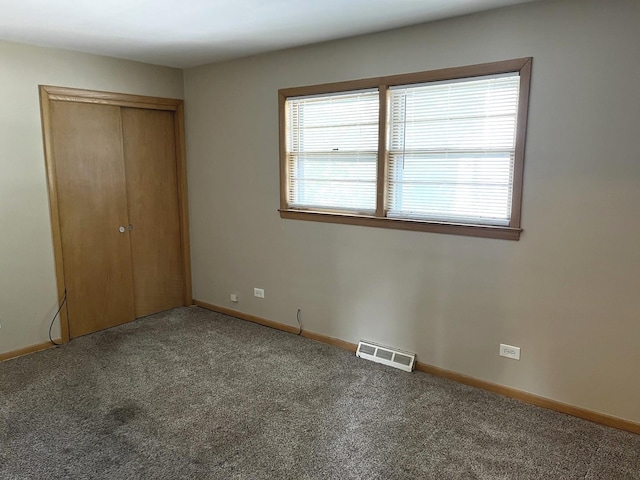 664 E 142nd St, Dolton, IL 60419 - unfurnished bedroom with carpet floors and a closet