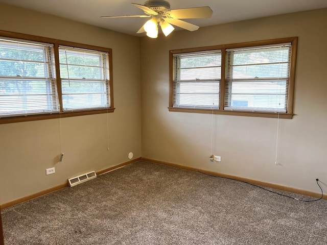 664 E 142nd St, Dolton, IL 60419 - empty room with carpet, healthy amount of natural light, and ceiling fan