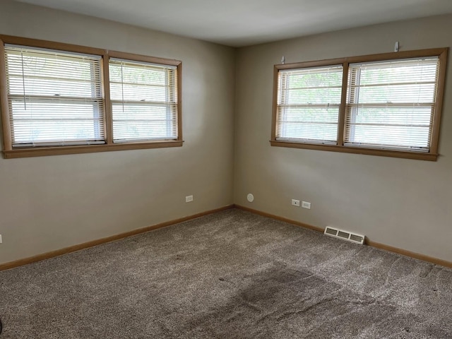 664 E 142nd St, Dolton, IL 60419 - carpeted empty room featuring baseboards