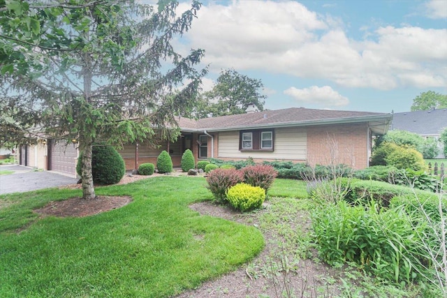 69 Grange Rd, Elk Grove Village, IL 60007 - ranch-style home with brick siding, a front yard, and driveway