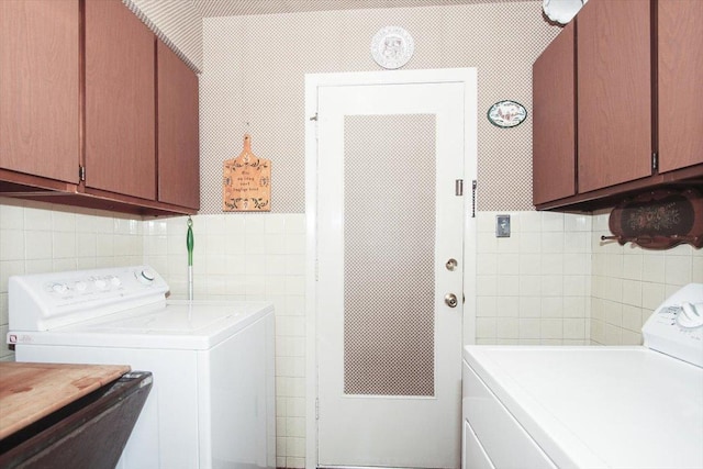 69 Grange Rd, Elk Grove Village, IL 60007 - laundry area featuring tile walls, washer and clothes dryer, and cabinet space