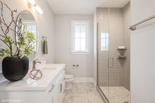 full bathroom with vanity, a stall shower, and marble look tile flooring