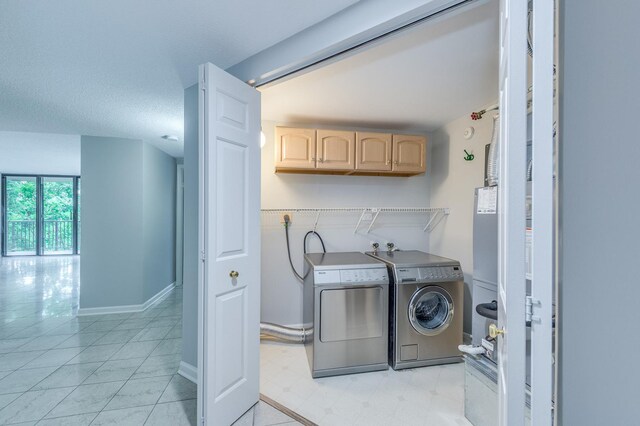 511 Aurora Ave Unit 410, Naperville, IL 60540 - laundry room with cabinet space and washing machine and clothes dryer