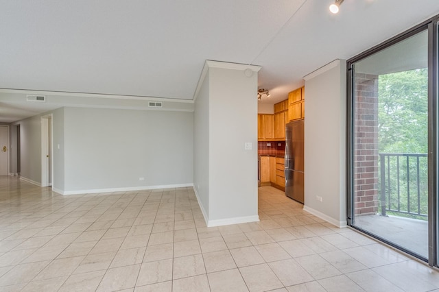 511 Aurora Ave Unit 410, Naperville, IL 60540 - empty room featuring plenty of natural light, floor to ceiling windows, and light tile patterned flooring