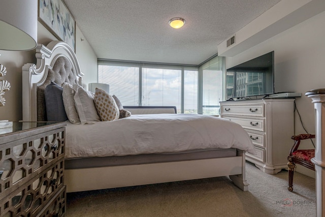 9655 Woods Dr Unit 1009, Skokie, IL 60077 - bedroom featuring a textured ceiling and light carpet