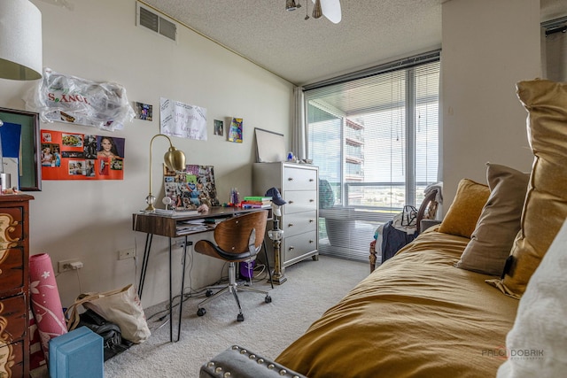 9655 Woods Dr Unit 1009, Skokie, IL 60077 - carpeted bedroom featuring a textured ceiling and a desk