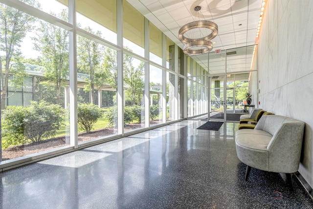 9655 Woods Dr Unit 1009, Skokie, IL 60077 - building lobby with a towering ceiling, expansive windows, and a paneled ceiling