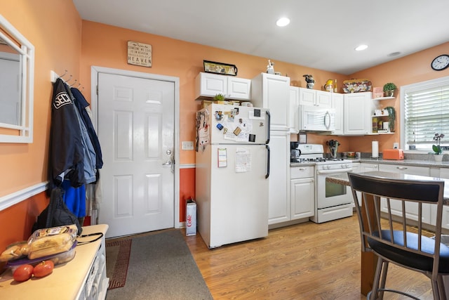 2602 Michael St, Wonder Lake, IL 60097 - kitchen with white appliances, white cabinets, light wood-style floors, recessed lighting, and open shelves