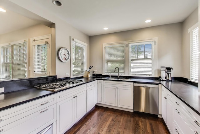 934 Jackson Ave, River Forest, IL 60305 - kitchen featuring appliances with stainless steel finishes, dark countertops, dark wood-style flooring, recessed lighting, and white cabinets