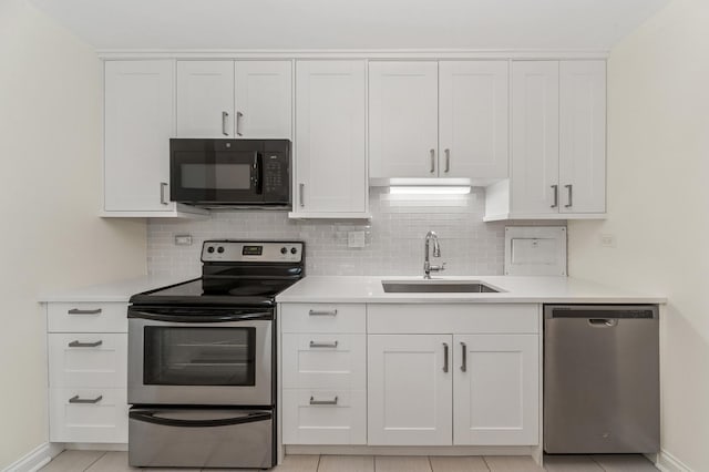 1605 E Central Rd Unit 411B, Arlington Heights, IL 60005 - kitchen featuring stainless steel appliances, decorative backsplash, light countertops, and white cabinets