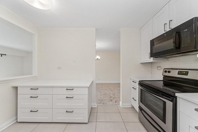 1605 E Central Rd Unit 411B, Arlington Heights, IL 60005 - kitchen featuring black microwave, stainless steel electric stove, white cabinetry, light countertops, and decorative backsplash