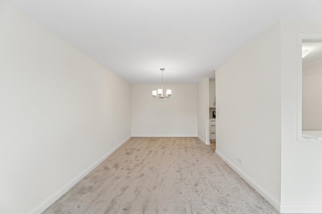 1605 E Central Rd Unit 411B, Arlington Heights, IL 60005 - empty room with a chandelier and light colored carpet
