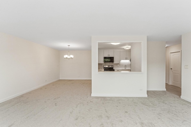 1605 E Central Rd Unit 411B, Arlington Heights, IL 60005 - unfurnished living room with a chandelier and light carpet