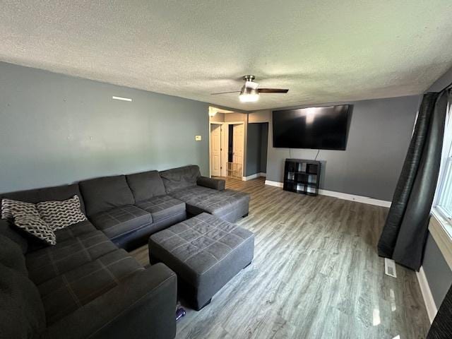 420 Wabash St, Wilmington, IL 60481 - living area with a textured ceiling, wood finished floors, and ceiling fan