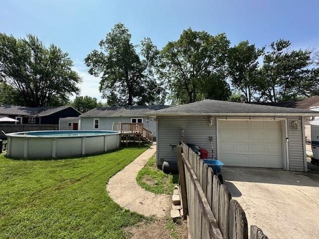 420 Wabash St, Wilmington, IL 60481 - view of front facade with driveway, a garage, and an outdoor structure