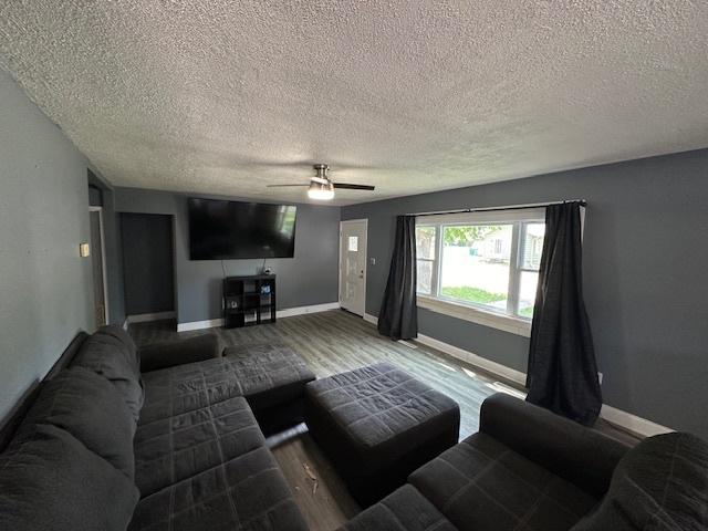 420 Wabash St, Wilmington, IL 60481 - living area with a textured ceiling, ceiling fan, and wood finished floors