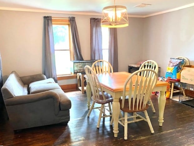 17218 Lincoln Rd, Morrison, IL 61270 - dining area featuring crown molding, hardwood / wood-style floors, and a chandelier