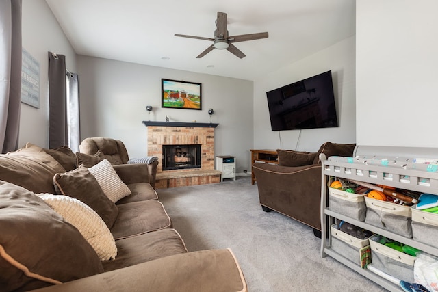 509 Magnolia Dr, North Aurora, IL 60542 - living area featuring carpet, ceiling fan, and a brick fireplace