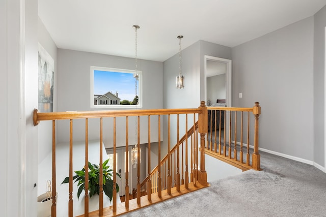 509 Magnolia Dr, North Aurora, IL 60542 - hall with an upstairs landing, carpet flooring, and a chandelier