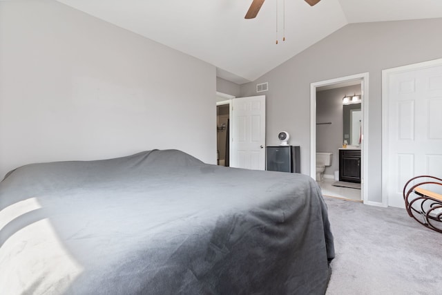 509 Magnolia Dr, North Aurora, IL 60542 - bedroom featuring lofted ceiling, light carpet, ensuite bathroom, and a ceiling fan
