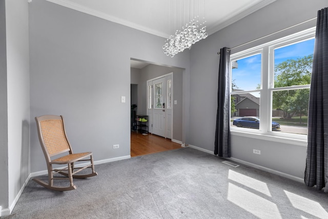 509 Magnolia Dr, North Aurora, IL 60542 - unfurnished room featuring carpet, crown molding, and a chandelier