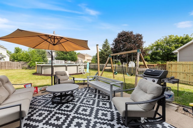 509 Magnolia Dr, North Aurora, IL 60542 - fenced backyard featuring a playground, outdoor lounge area, a patio, and a grill