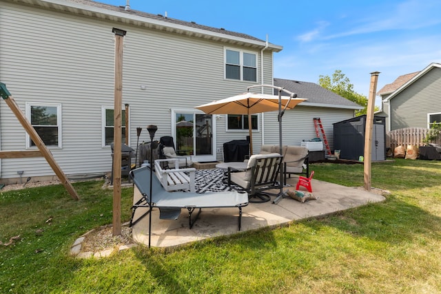 509 Magnolia Dr, North Aurora, IL 60542 - back of house featuring a storage unit, a patio area, and a yard