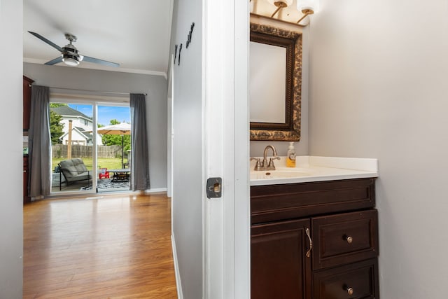 509 Magnolia Dr, North Aurora, IL 60542 - bathroom with ornamental molding, vanity, a ceiling fan, and wood finished floors