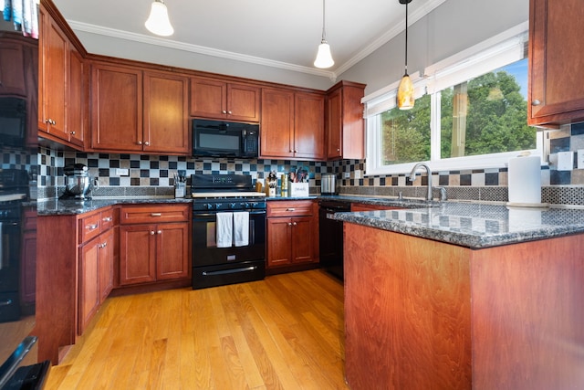 509 Magnolia Dr, North Aurora, IL 60542 - kitchen featuring black appliances, ornamental molding, light wood-style flooring, decorative backsplash, and pendant lighting