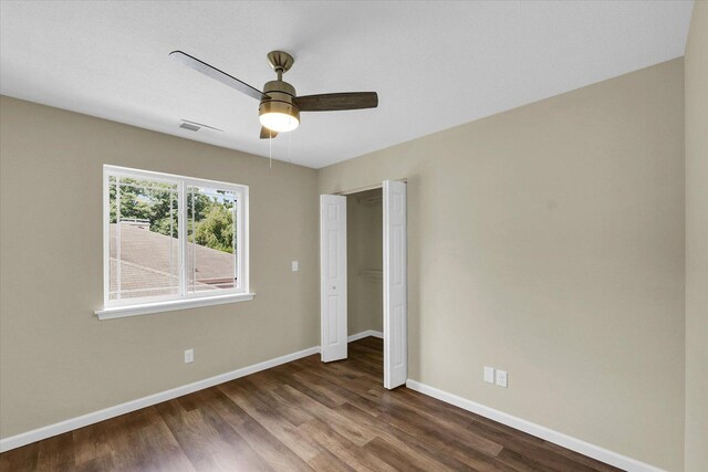 5 Montclair Rd Unit A, Urbana, IL 61801 - unfurnished bedroom with dark wood-style flooring and a ceiling fan