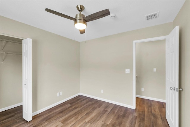 5 Montclair Rd Unit A, Urbana, IL 61801 - unfurnished bedroom featuring wood finished floors, a closet, ceiling fan, and attic access
