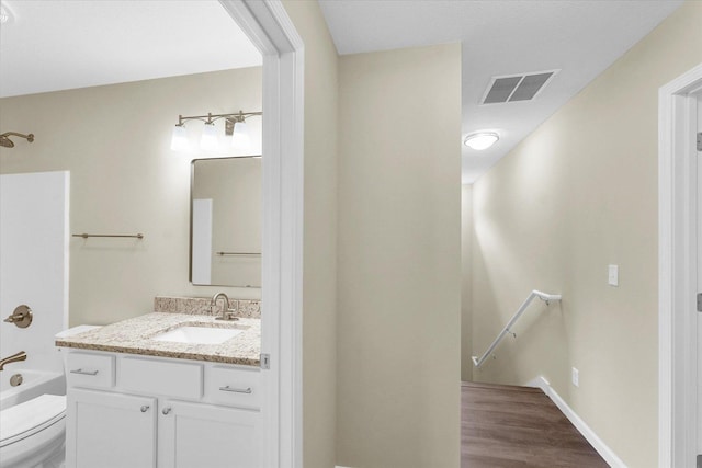 5 Montclair Rd Unit A, Urbana, IL 61801 - bathroom with vanity, wood finished floors, and shower / tub combination
