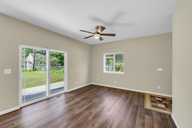5 Montclair Rd Unit A, Urbana, IL 61801 - empty room with a ceiling fan and dark wood-style flooring