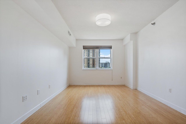 5 E 14th Pl Unit 602, Chicago, IL 60605 - unfurnished room with light wood-style flooring and baseboards