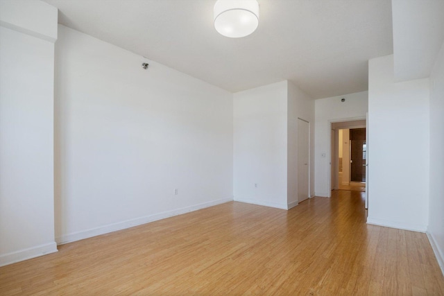 5 E 14th Pl Unit 602, Chicago, IL 60605 - unfurnished room with light wood-style flooring and baseboards