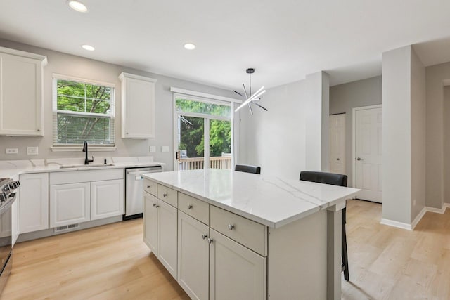 5608 Cambridge Way, Hanover Park, IL 60133 - kitchen with stainless steel appliances, a kitchen island, a chandelier, light wood-type flooring, and recessed lighting