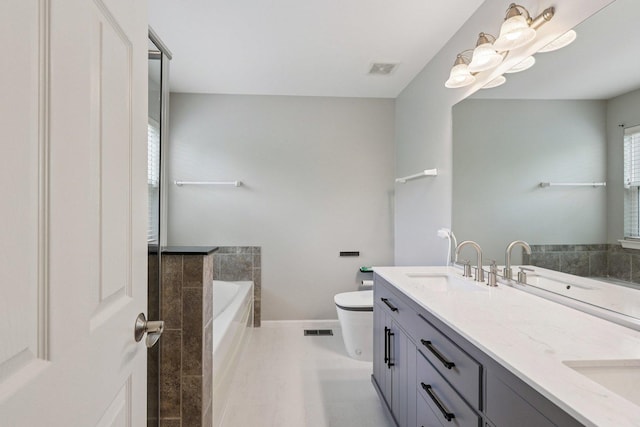 5608 Cambridge Way, Hanover Park, IL 60133 - bathroom with a garden tub and double vanity