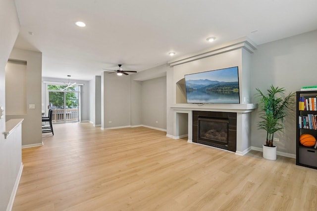 5608 Cambridge Way, Hanover Park, IL 60133 - unfurnished living room with ceiling fan, light wood-style flooring, a fireplace, and recessed lighting