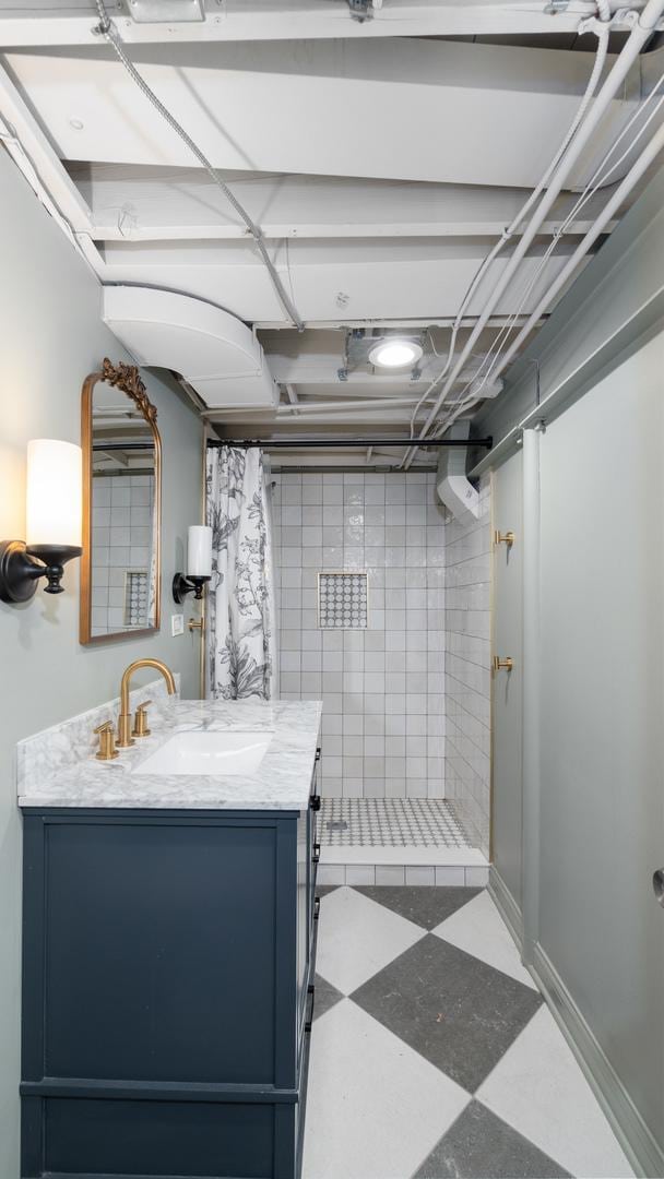 5660 N Rogers Ave, Chicago, IL 60646 - full bathroom with tiled shower, tile patterned floors, and vanity